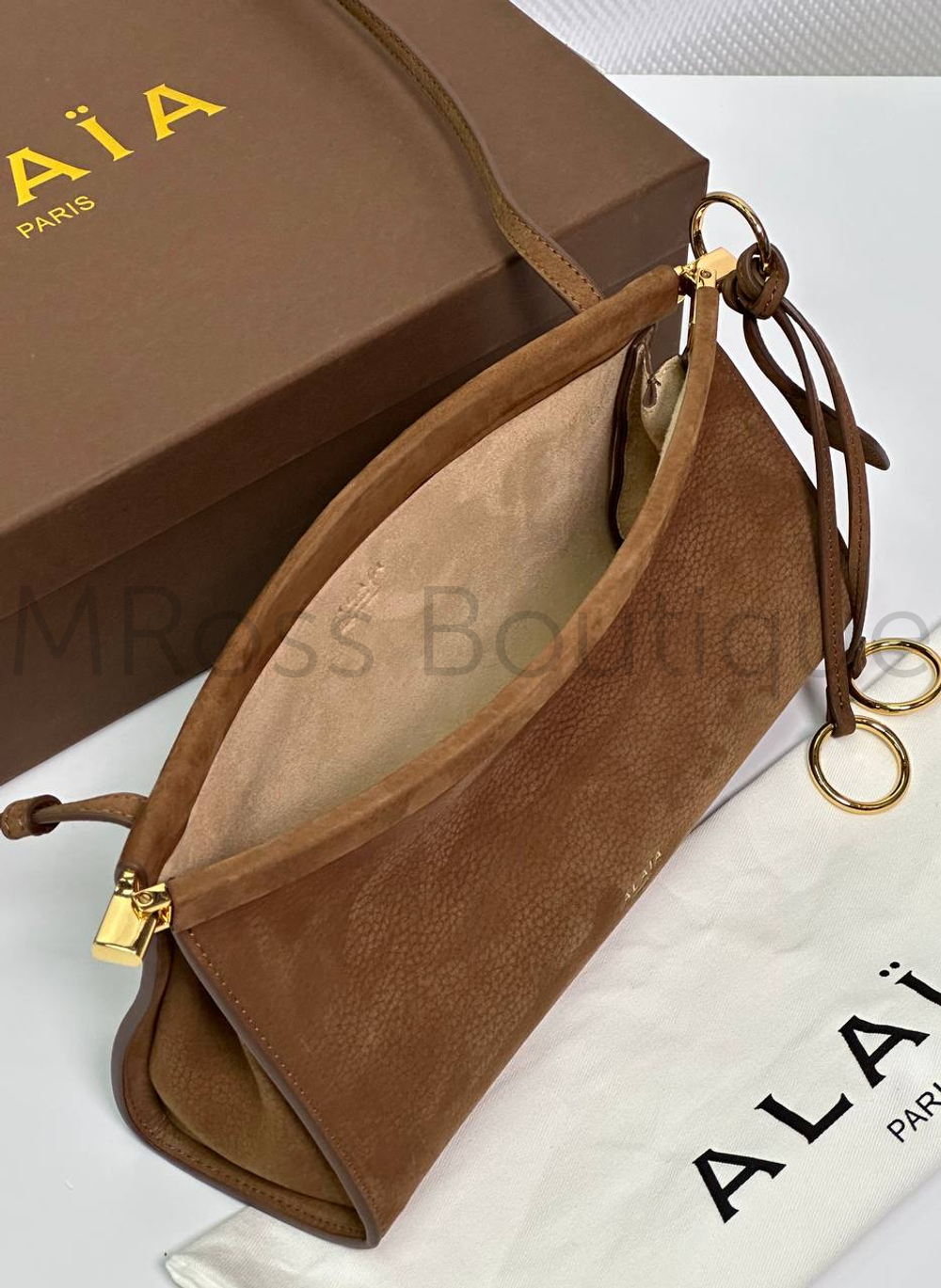 Женская сумка Alaia Le Click East West коричневого цвета замшевая