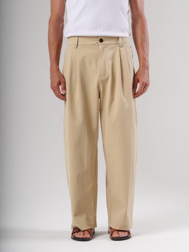 Бежевые брюки свободного кроя