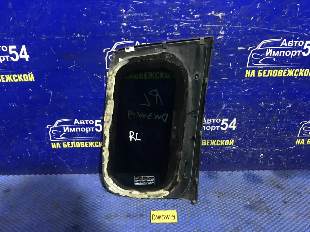 Стекло багажника левое MAZDA DEMIO 2000