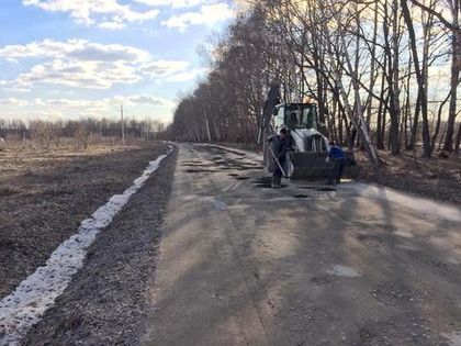В «Романовском Парке» начался ямочный ремонт подъездной дороги