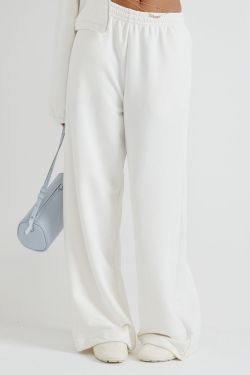 Широкие джоггеры без начеса с утяжкой кремового цвета