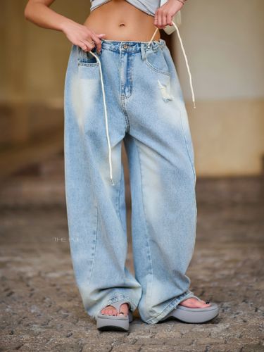 Голубые джинсы-трансформеры с потертостями