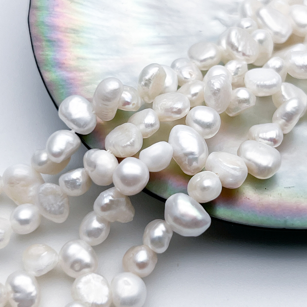 Жемчуг, размер около 6,5-7*5-5,5 мм, цена за отрезок 17 см (1/2 нити)