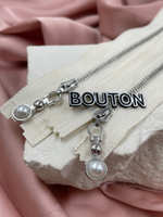 Молния бежевая (молочная) серебро с бегунком жемчужиной