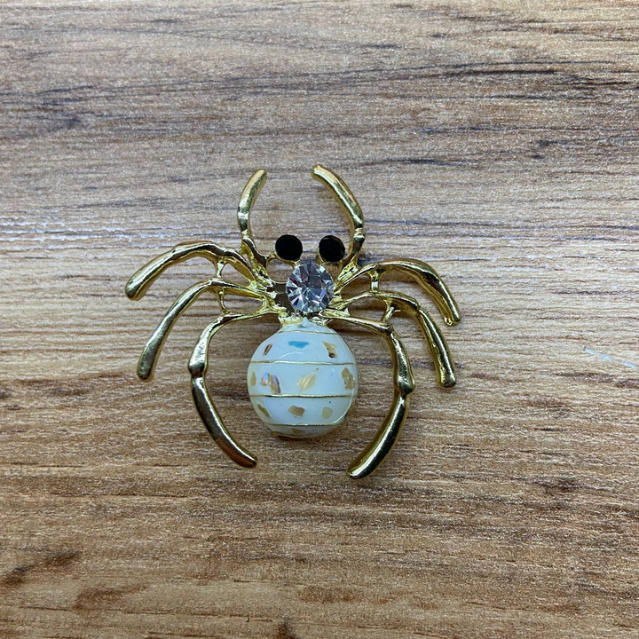 Брошь-кулон Паук эмаль белая гелиотис кристалл металл золотистый