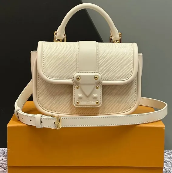 Сумка Louis Vuitton Hide And Seek кремовый