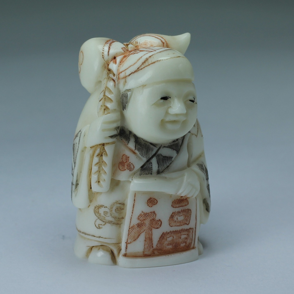 Нэцкэ Ребенок с тыквой горлянкой и табличкой "счастья"