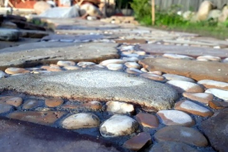 Paving of paths with stone and paving stones