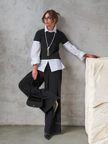 Трикотажный черный костюм с вышивкой-лого