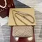 Стеганая мини-сумка Gucci GG Marmont бежевый