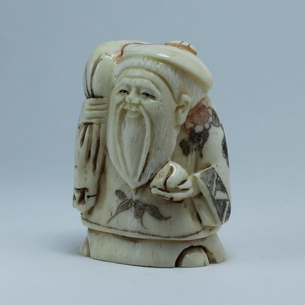 Нэцкэ Фукурокудзю с мешком риса и персиком