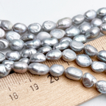 Жемчуг бусины, цвет серый, размер около 6,8-8*6-6,5 мм, цена за отрезок 17 см (1/2 нити)