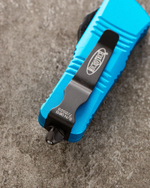 Автоматический складной нож Microtech Mini Troodon Black Tanto 240-1BL (голубой) фронталка/выкидуха