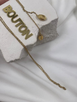 Колье золотистое с длинной цепью и подвесами на концах в виде ракушек