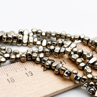 Гематит Фриформ бусины (имитация), цвет золотистый, размер около 5-6*2,8-3 мм, цена за отрезок 19 см (1/2 нити)