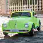 Детский электромобиль "Volkswagen Beetle" JE1818 12V, зеленый
