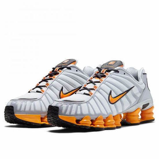 white and orange shox