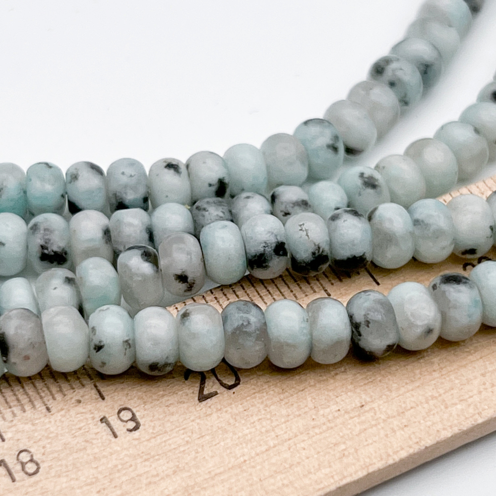 Пегматит амазонитовый, размер около 4*6 мм, цена за 55-56 шт (1/2 нити)