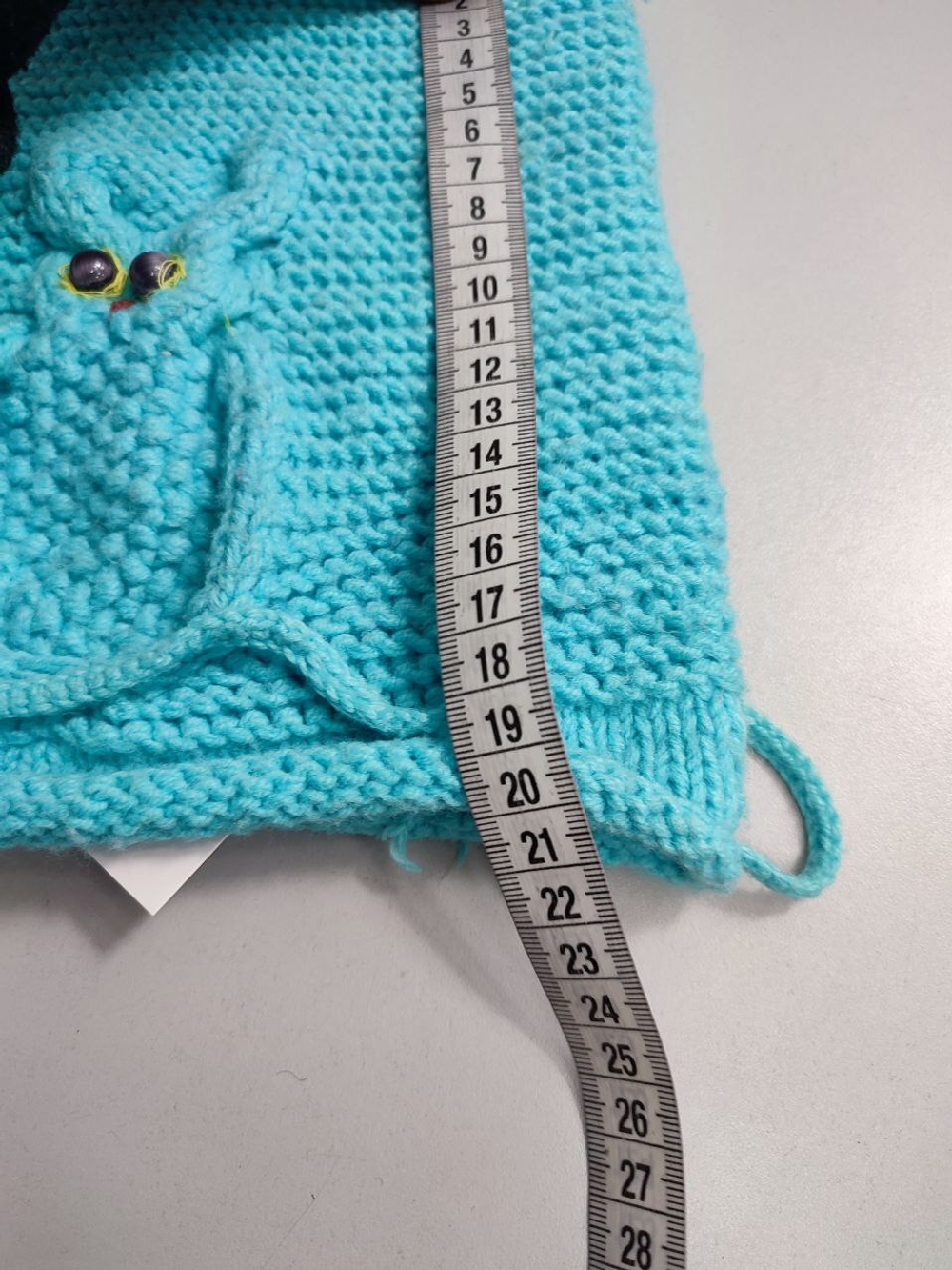 Шапка с кисточками