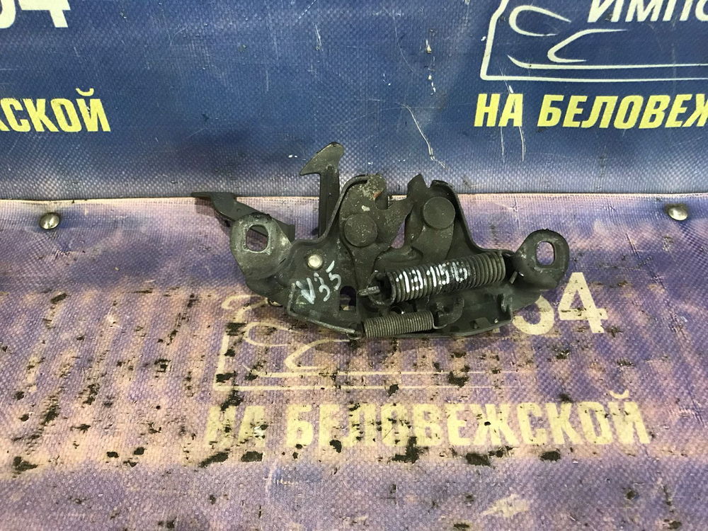 Замок капота NISSAN SKYLINE 2001-2004