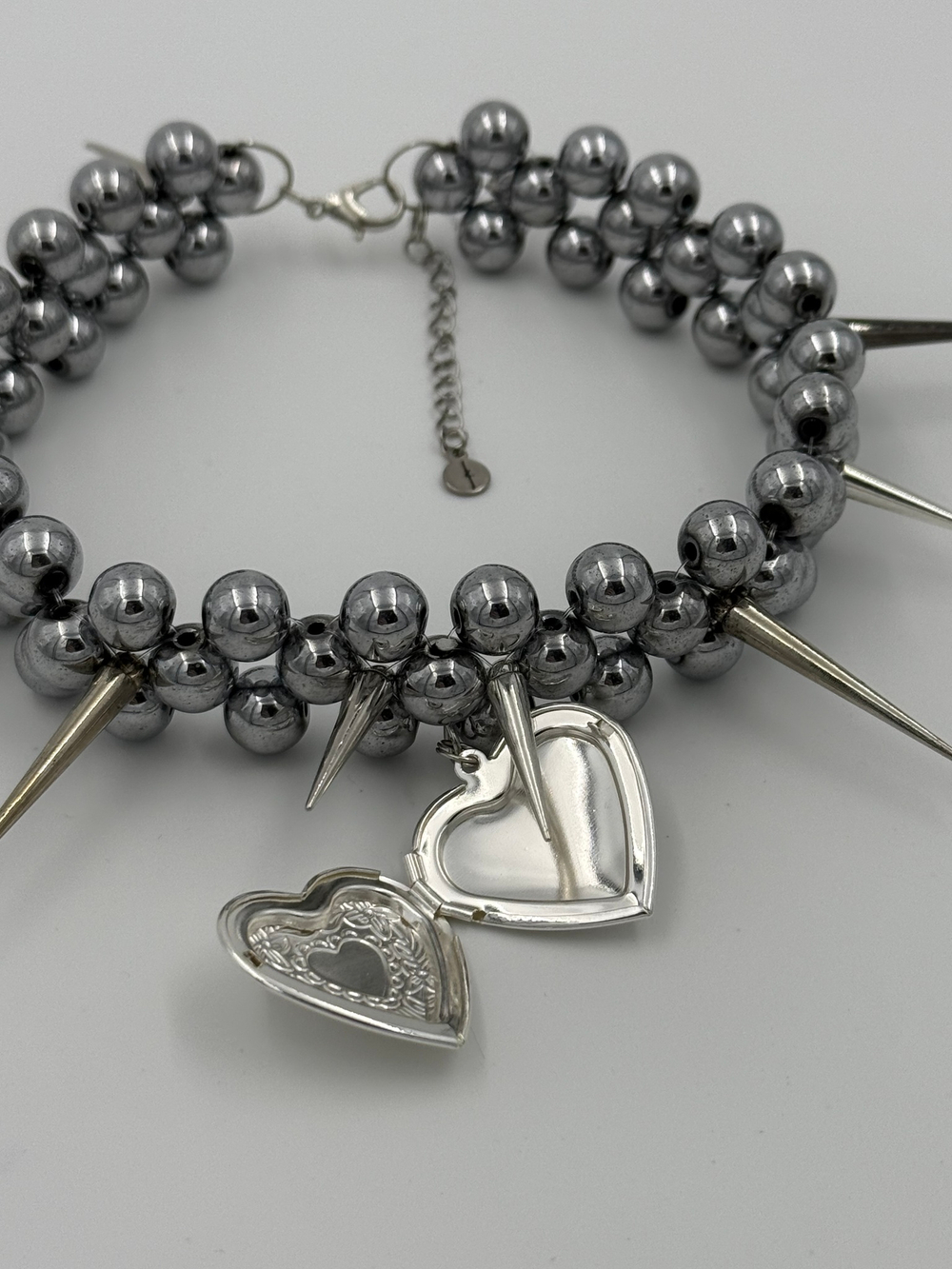 sharp medallion necklace