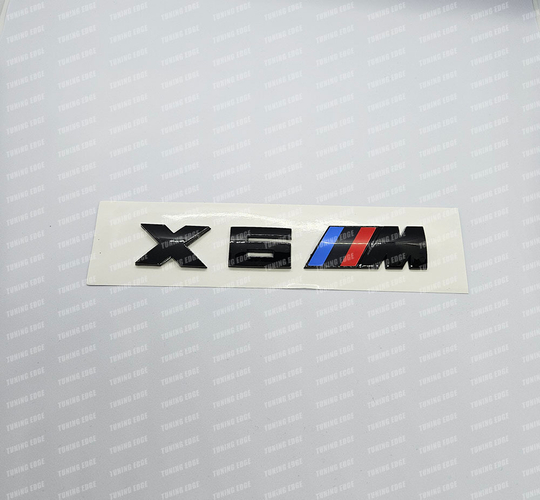 Эмблема X6M