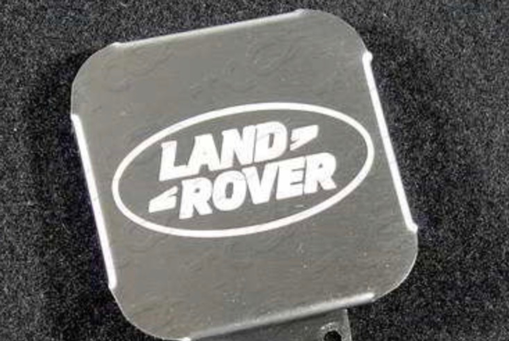 Заглушка на фаркоп под квадрат 50x50 с логотипом Land Rover, (нерж.сталь) TCUZLNDROV1
