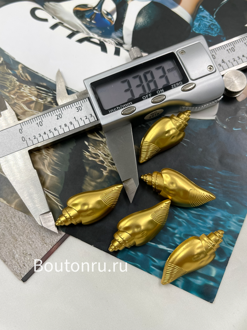 Пуговицы матовое золото Скиапар. в форме ракушки