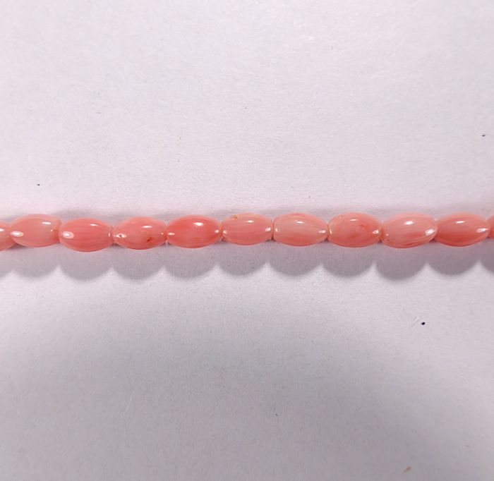 Бусина из коралла розового, облагороженного, фигурная, 3x6 мм (овал, гладкая)