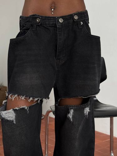 Черные рваные джинсы-трансформеры