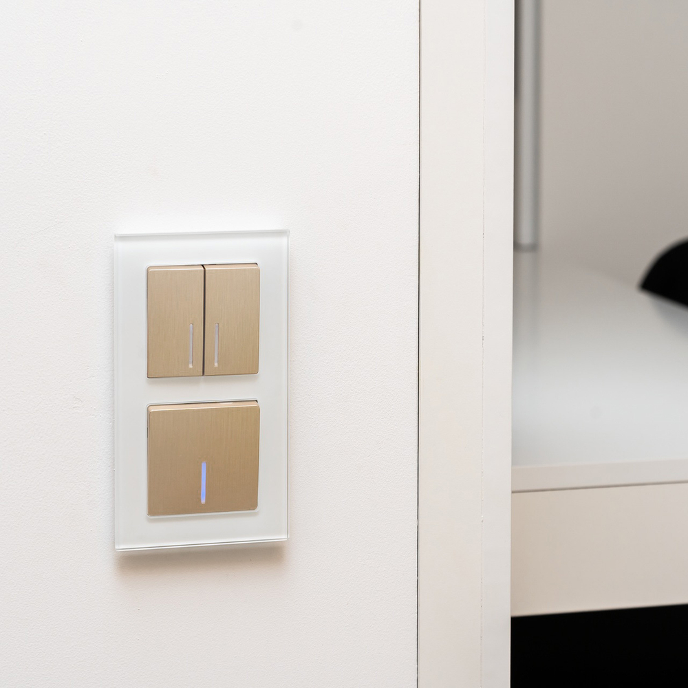 Выключатель двухклавишный проходной с подсветкой (шампань рифленый)