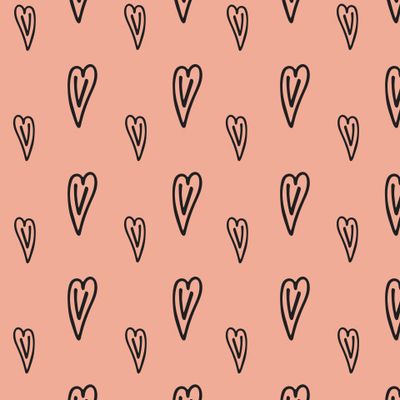 Черное сердечки на персиковом фоне.