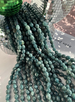 Нить бусин из тонированного кварца 8-8,5мм (галтовка)