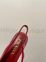 Красные туфли Prada с открытой пяткой на каблуке