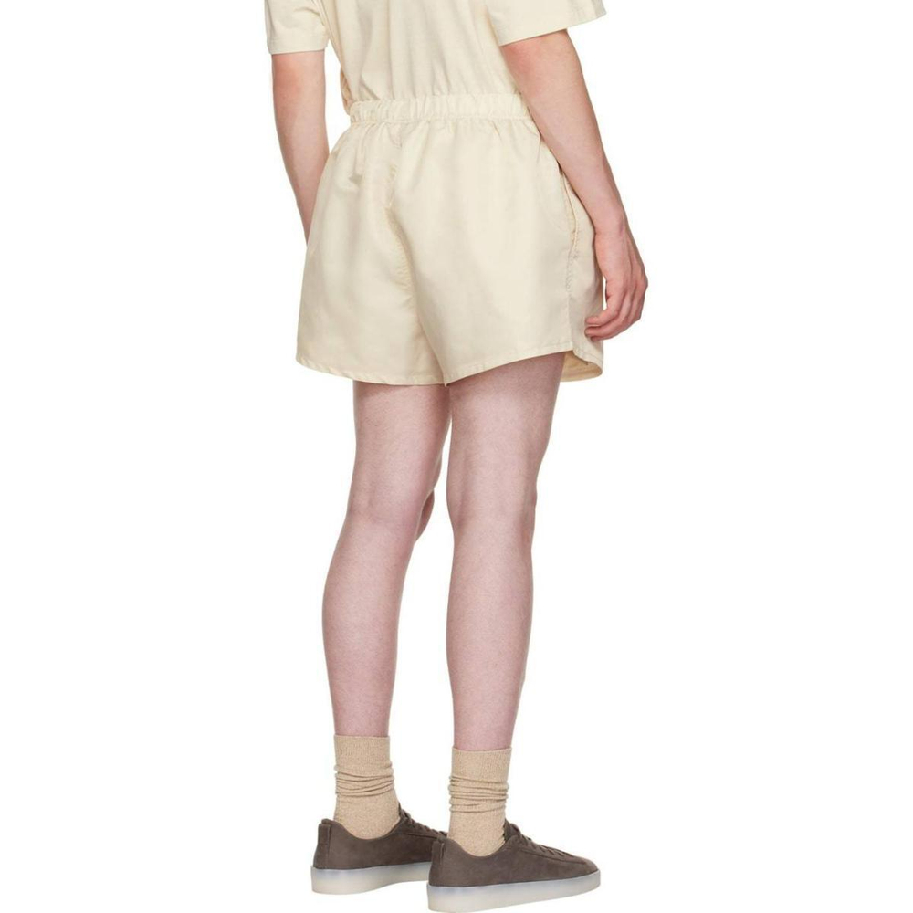 Шорты Fear of God Essentials FW22 Nylon Running Shorts Egg shell Logo, FOG-FW22-37