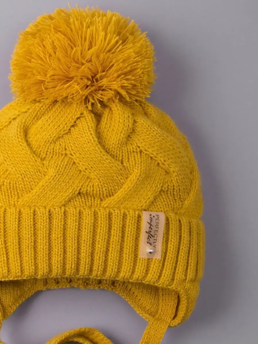 Шапка вязаная демисезонная на завязках для детей