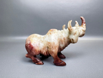 Фигура носорога из камня