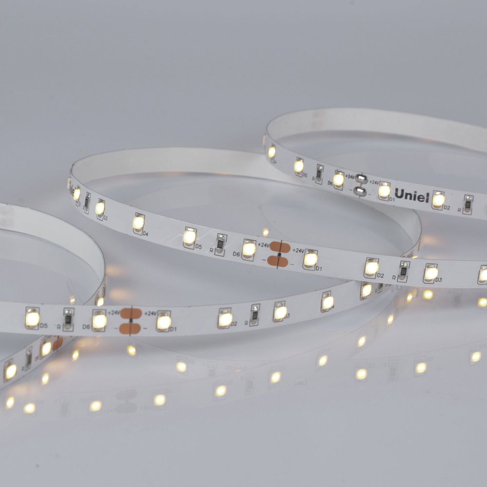 ULS-2835-60LED-m-8mm-IP20-DC24V-6W-m-5M-WW Гибкая светодиодная лента на самоклеящейся основе. Катушка 5 м. в герметичной упаковке. Теплый белый свет 3000K. ТМ Uniel.