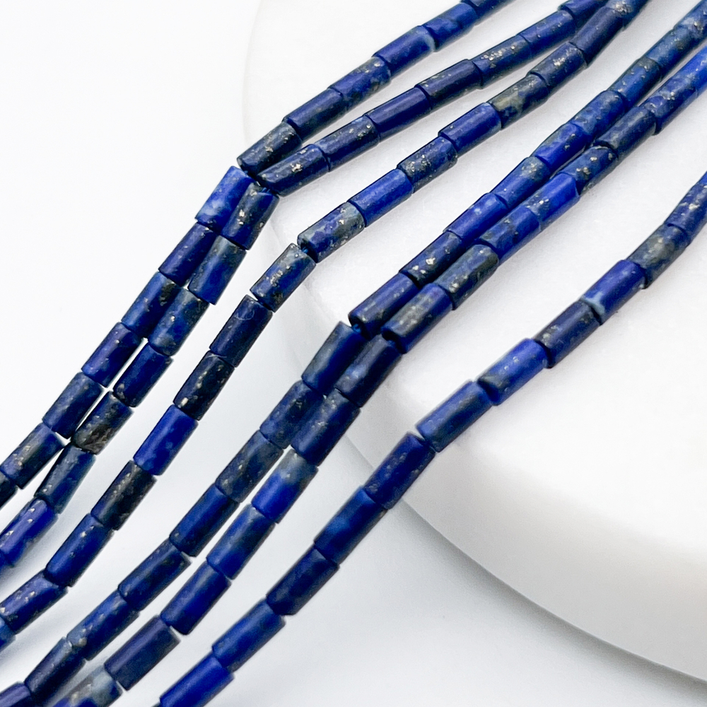 Лазурит бусины, размер около 4,3*2,2 мм, цена за отрезок 19 см (1/2 нити)