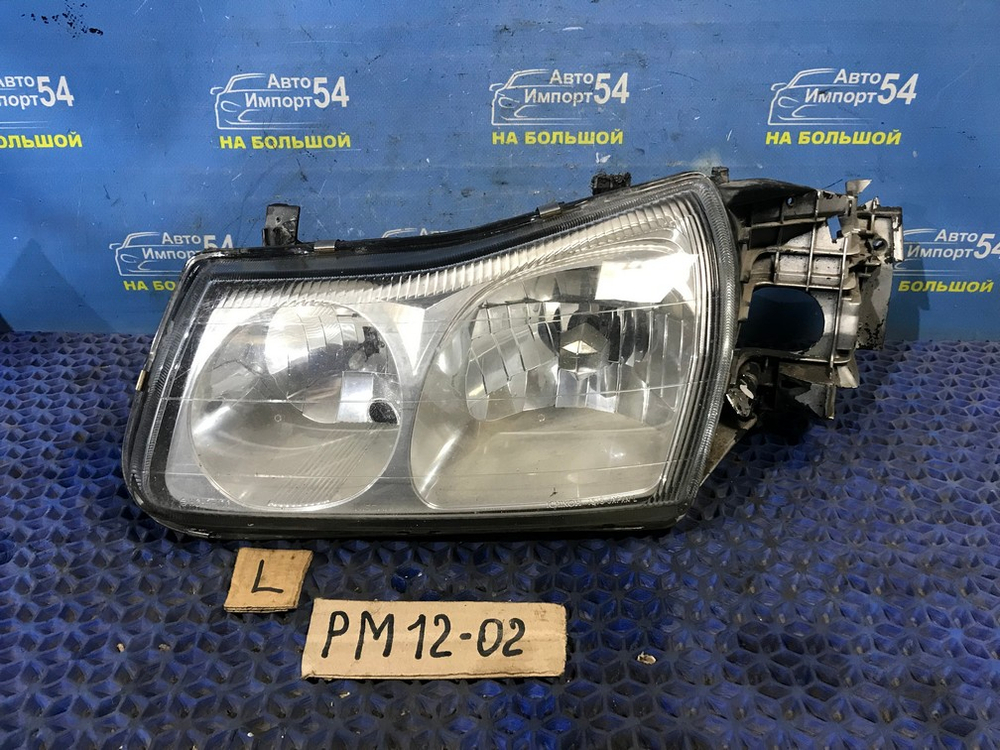 Фара передняя левая NISSAN LIBERTY 1999