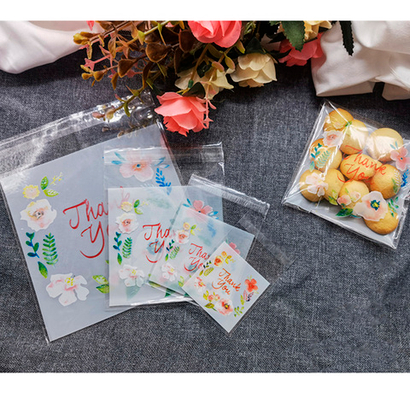 100 штук Пакетиков упаковочных с цветочным рисунком, надписью thank you и клеевым клапаном