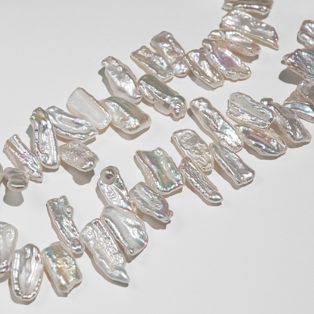 Жемчуг культивированный Бива, белый, со смещенным боковым отверстием 12-22мм