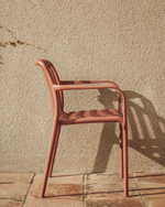 Уличный стул Isabellini из пластика терракотового цвета