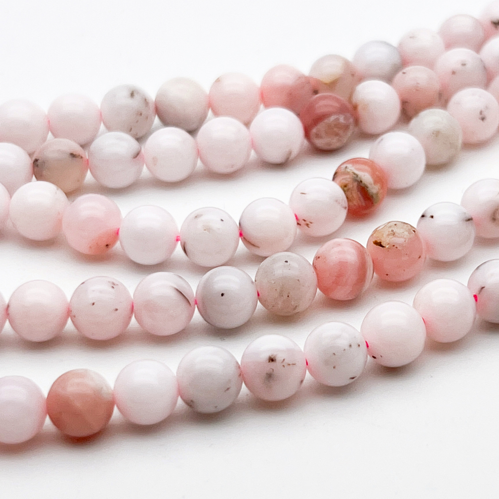 Опал розовый бусины, диаметр около 6,4-6,7 мм, цена за 15 шт (1/4 нити)