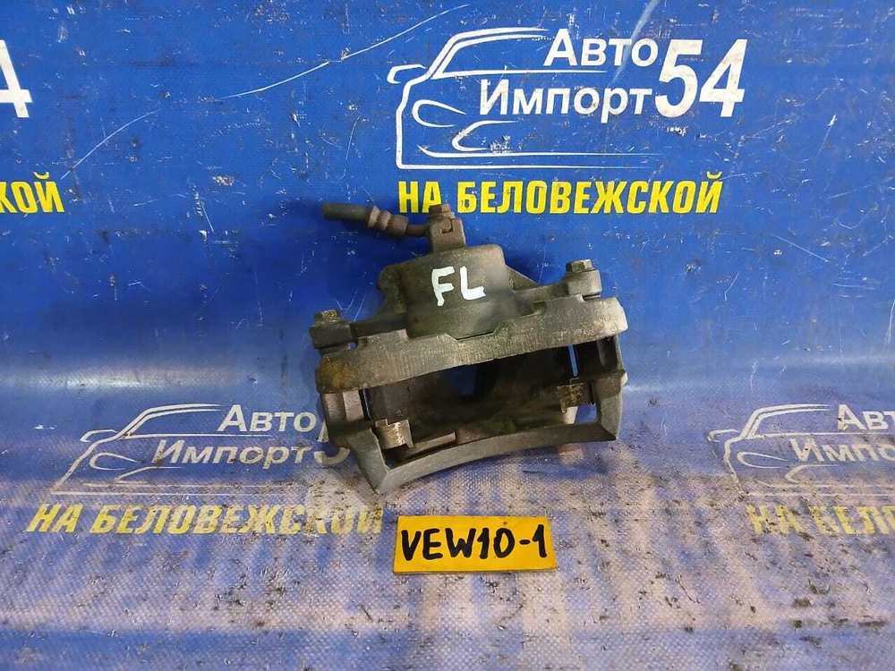 Суппорт тормозной передний левый NISSAN AVENIR 1997