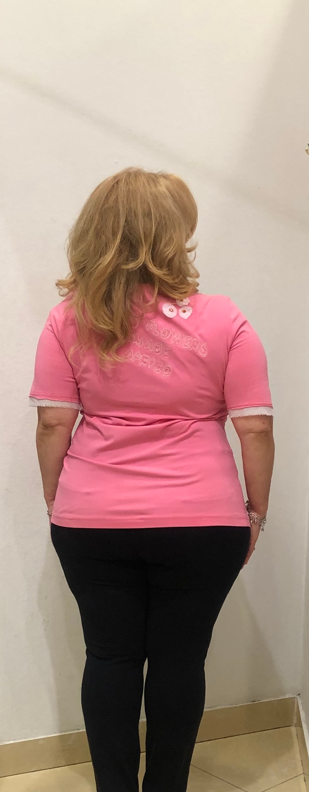 Розовый трикотажный блузон с белым бантом