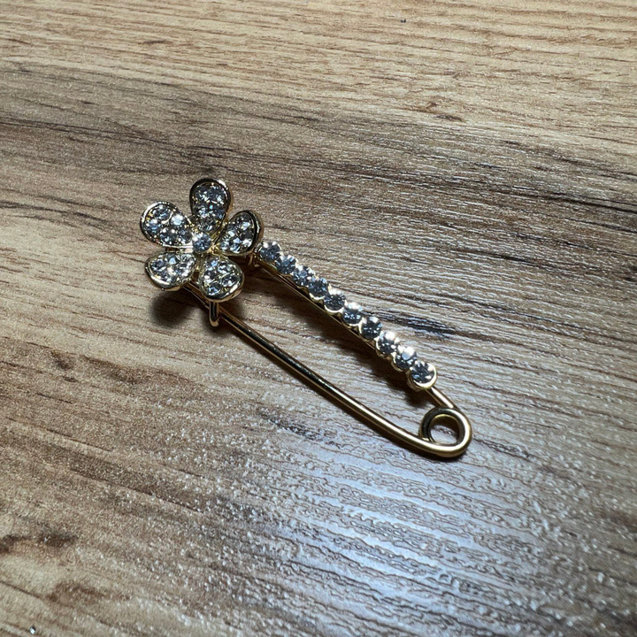 Брошь-булавка пятилистник изогнутый 10 кристаллов стразы металл золотистый 5 см