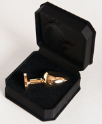 Маленькая золотистая анальная втулка с чёрным кристаллом