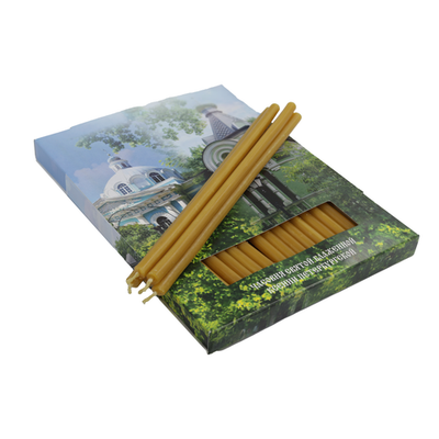 Свечи в картонной коробке с изображением часовни святой блаженной Ксении Петербургской и храма Смоленской иконы Божией Матери