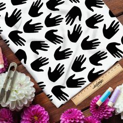 Ткань дюспо чёрные ладони на белом фоне